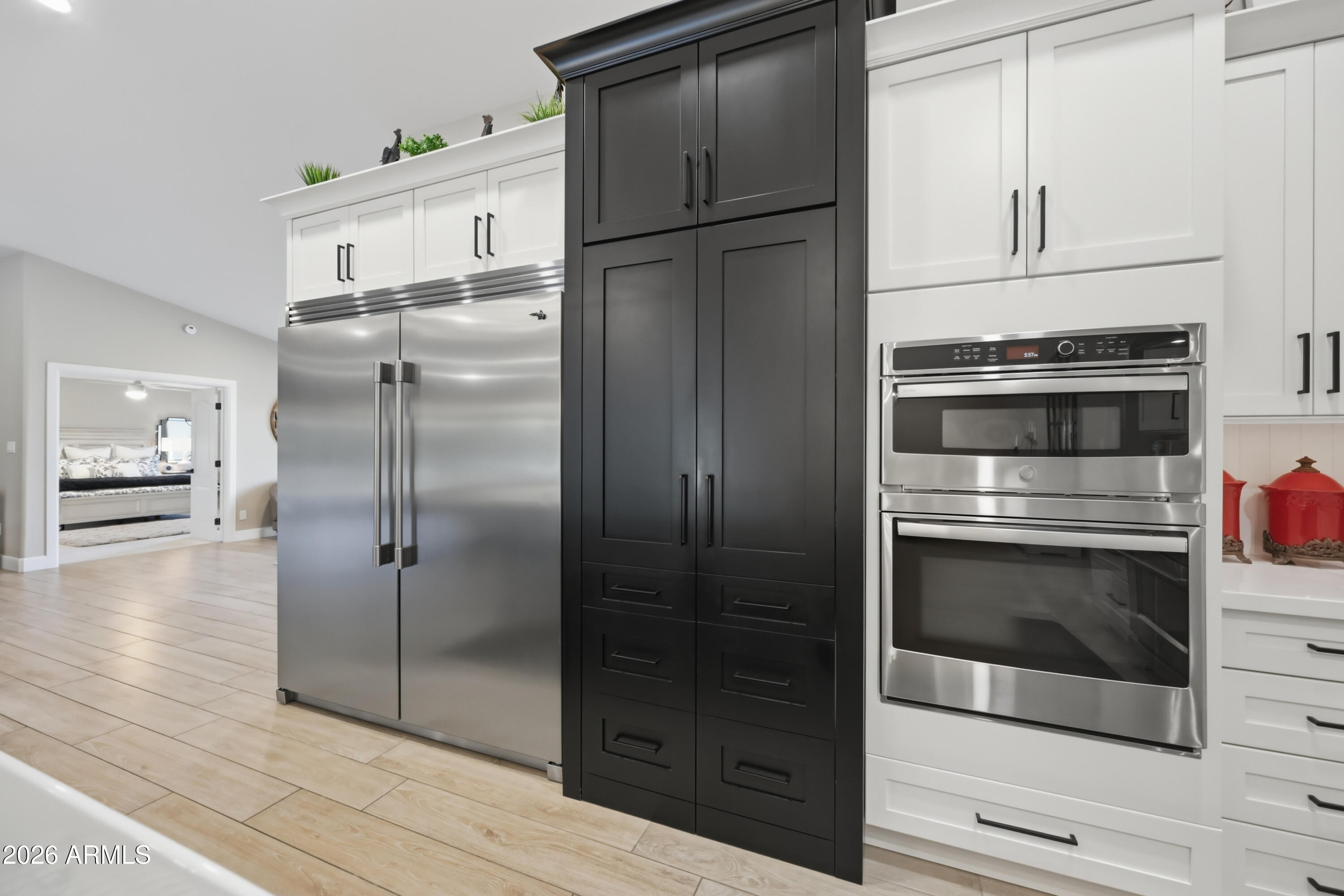 5213 West Dobbins Road Laveen, AZ 85339 - Photo 16 of 69 a kitchen with cabinets and stainless steel appliances