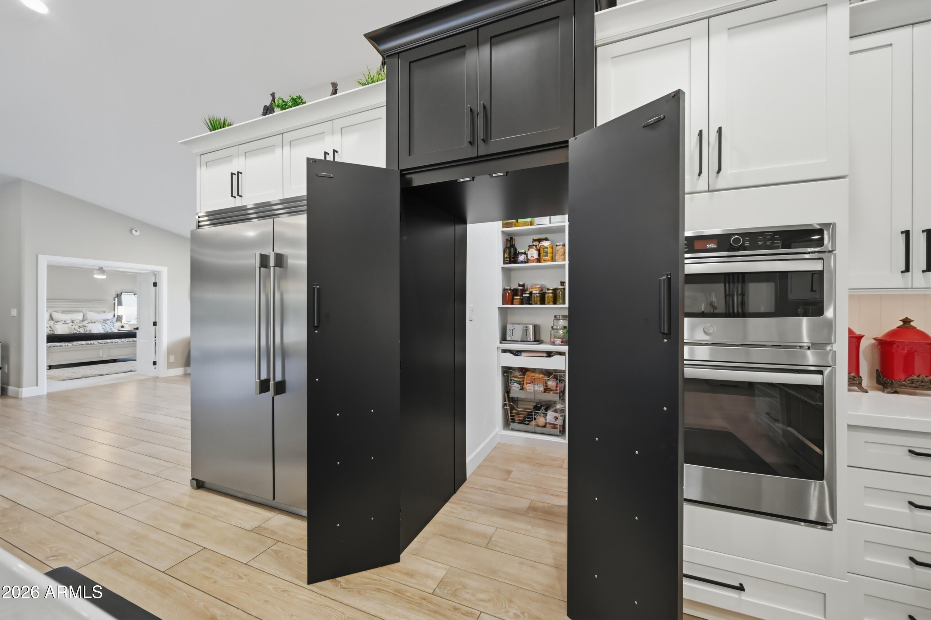5213 West Dobbins Road Laveen, AZ 85339 - Photo 17 of 69 a kitchen with stainless steel appliances and refrigerator