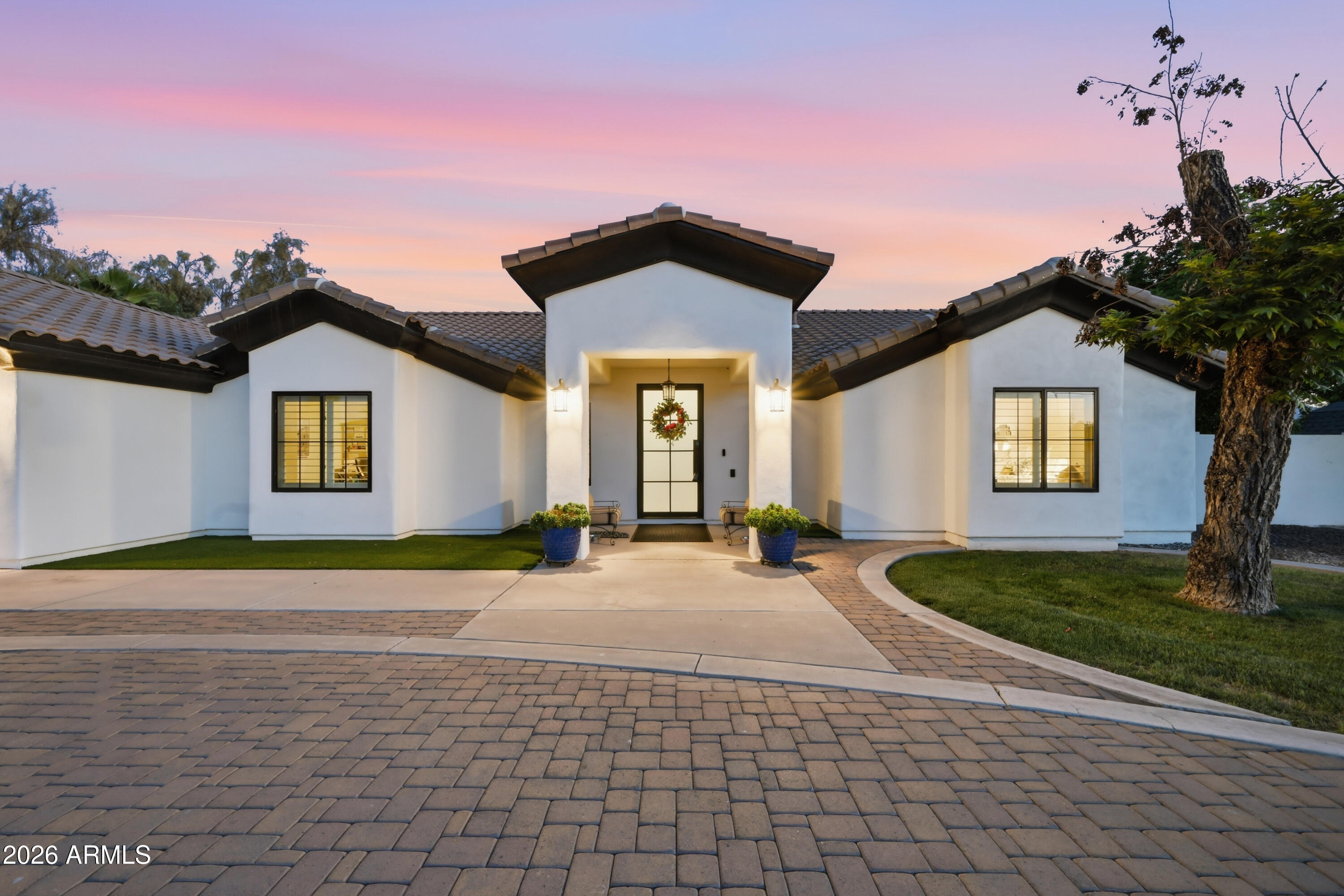 5213 West Dobbins Road Laveen, AZ 85339 - Photo 3 of 69 a front view of a house with garden