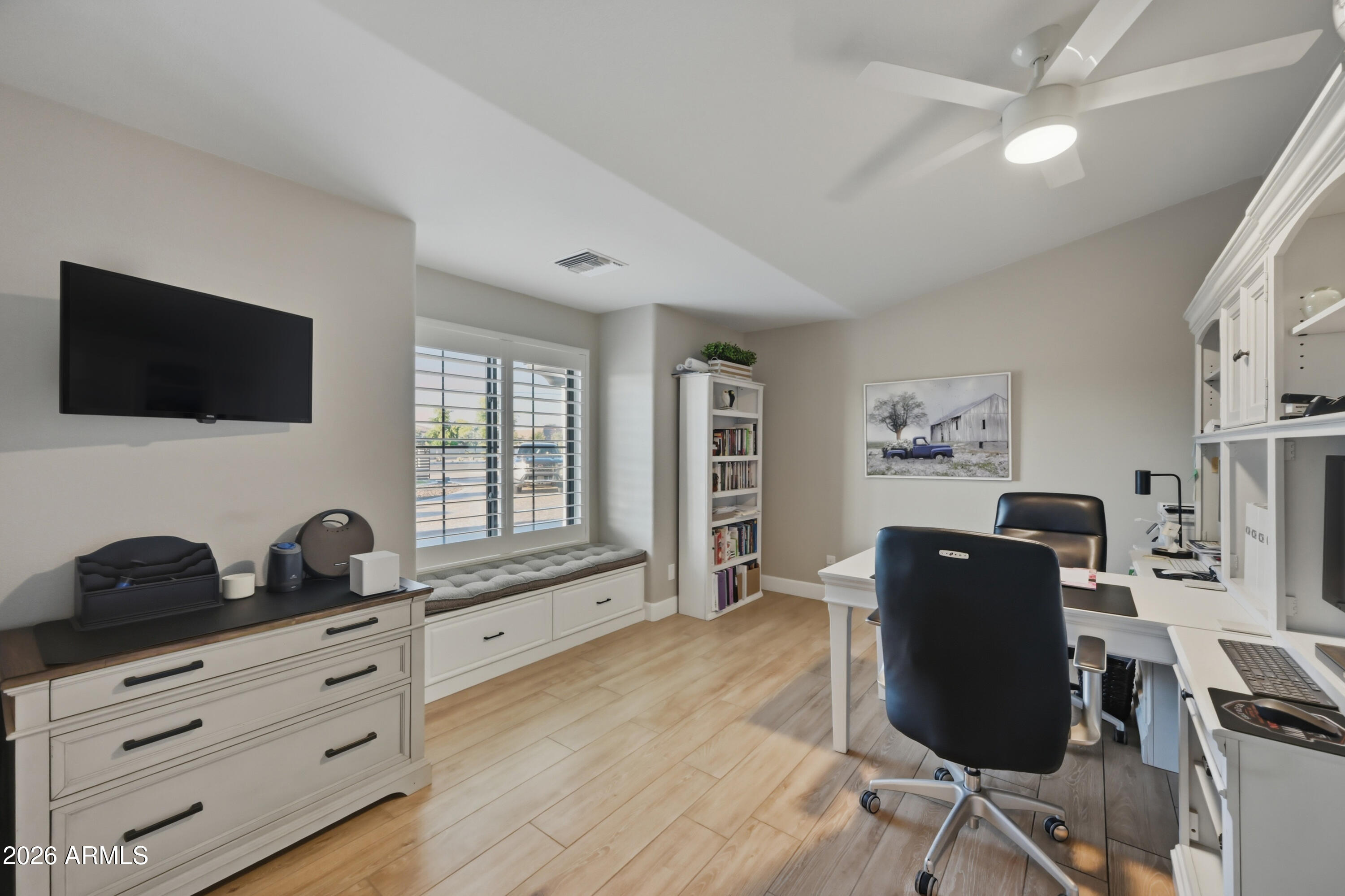 5213 West Dobbins Road Laveen, AZ 85339 - Photo 31 of 69 a view of a workspace with furniture and a window