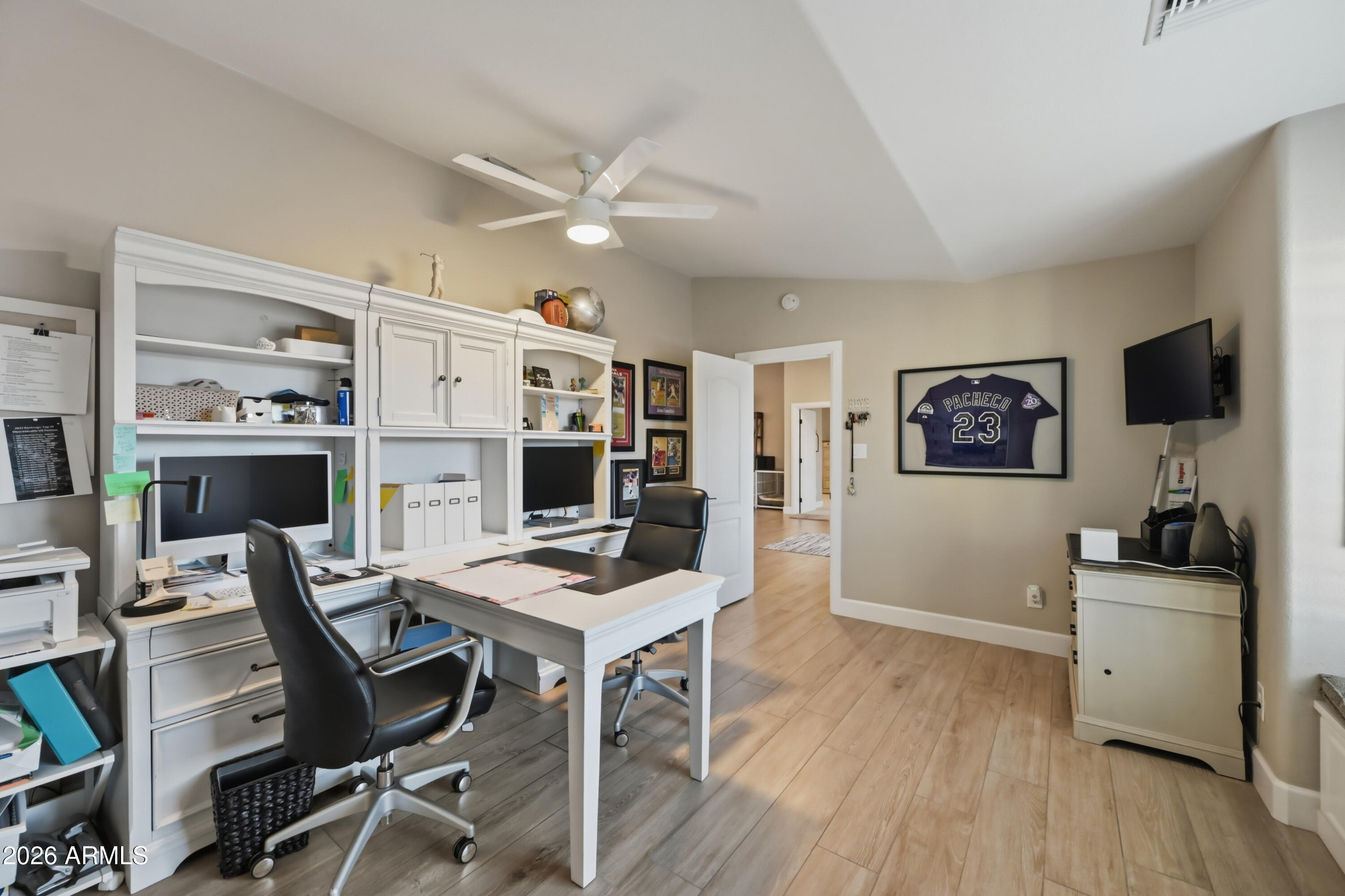 5213 West Dobbins Road Laveen, AZ 85339 - Photo 32 of 69 a workspace with furniture and wooden floor