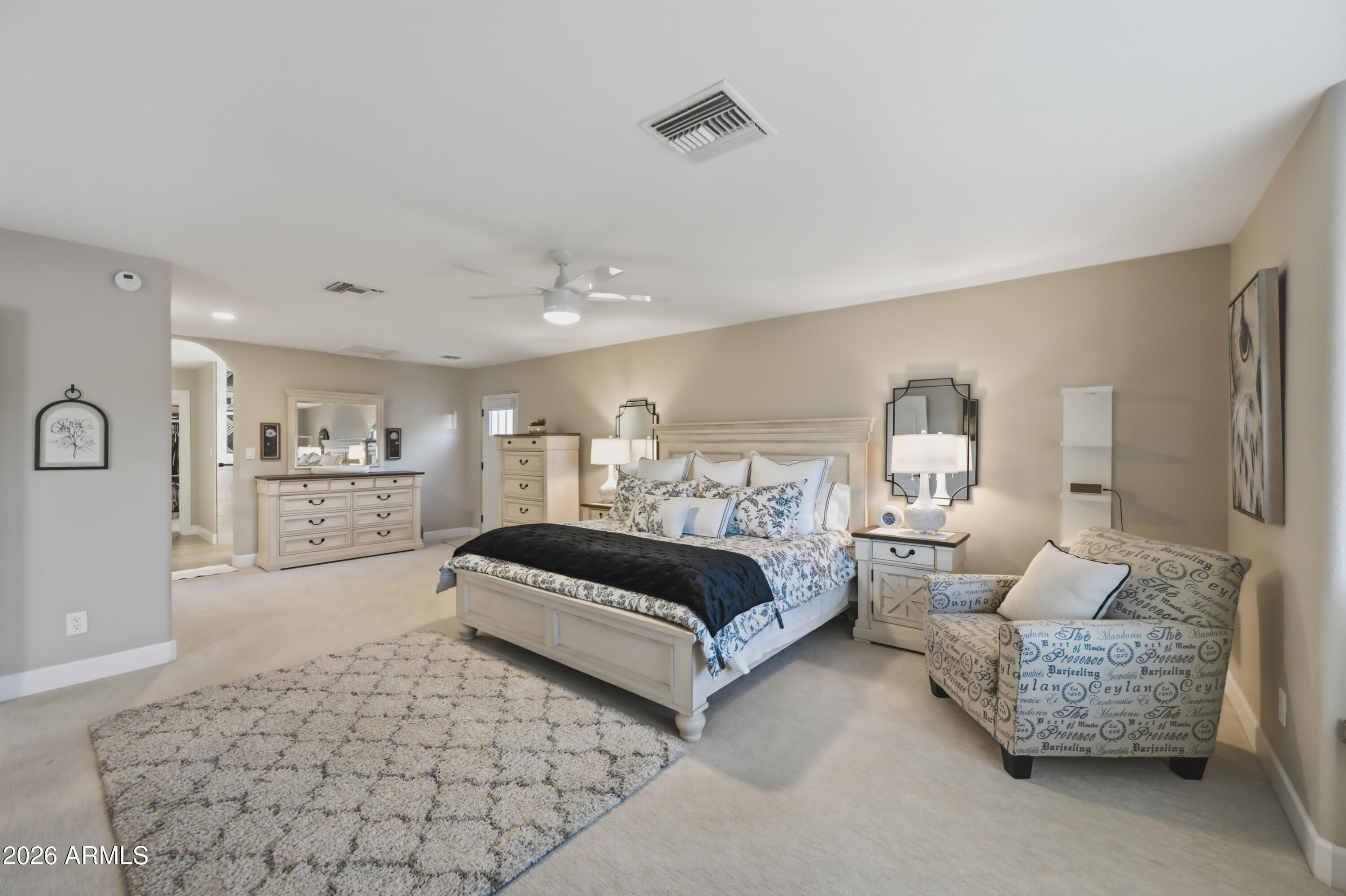 5213 West Dobbins Road Laveen, AZ 85339 - Photo 33 of 69 a spacious bedroom with a bed and a couch