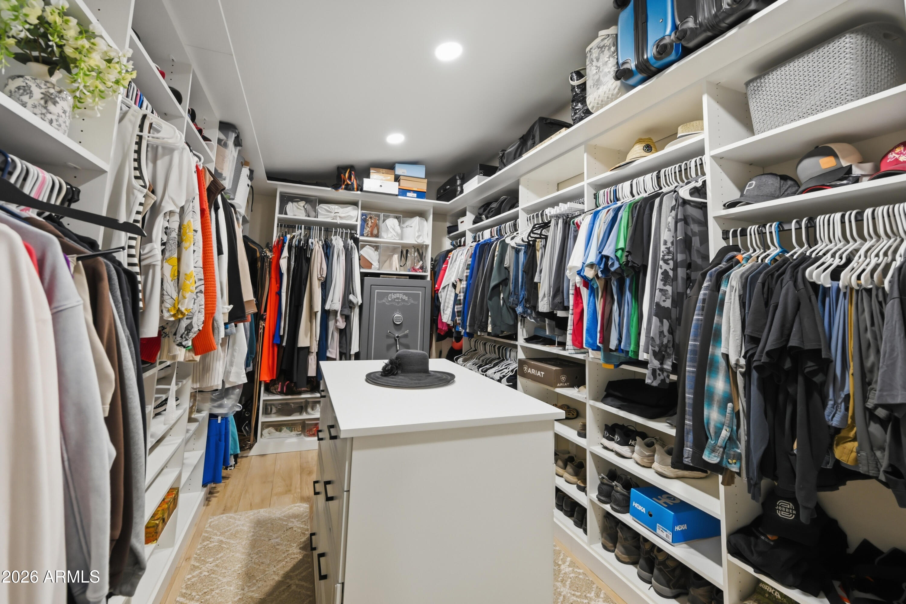 5213 West Dobbins Road Laveen, AZ 85339 - Photo 40 of 69 a view of walk in closet with clothes