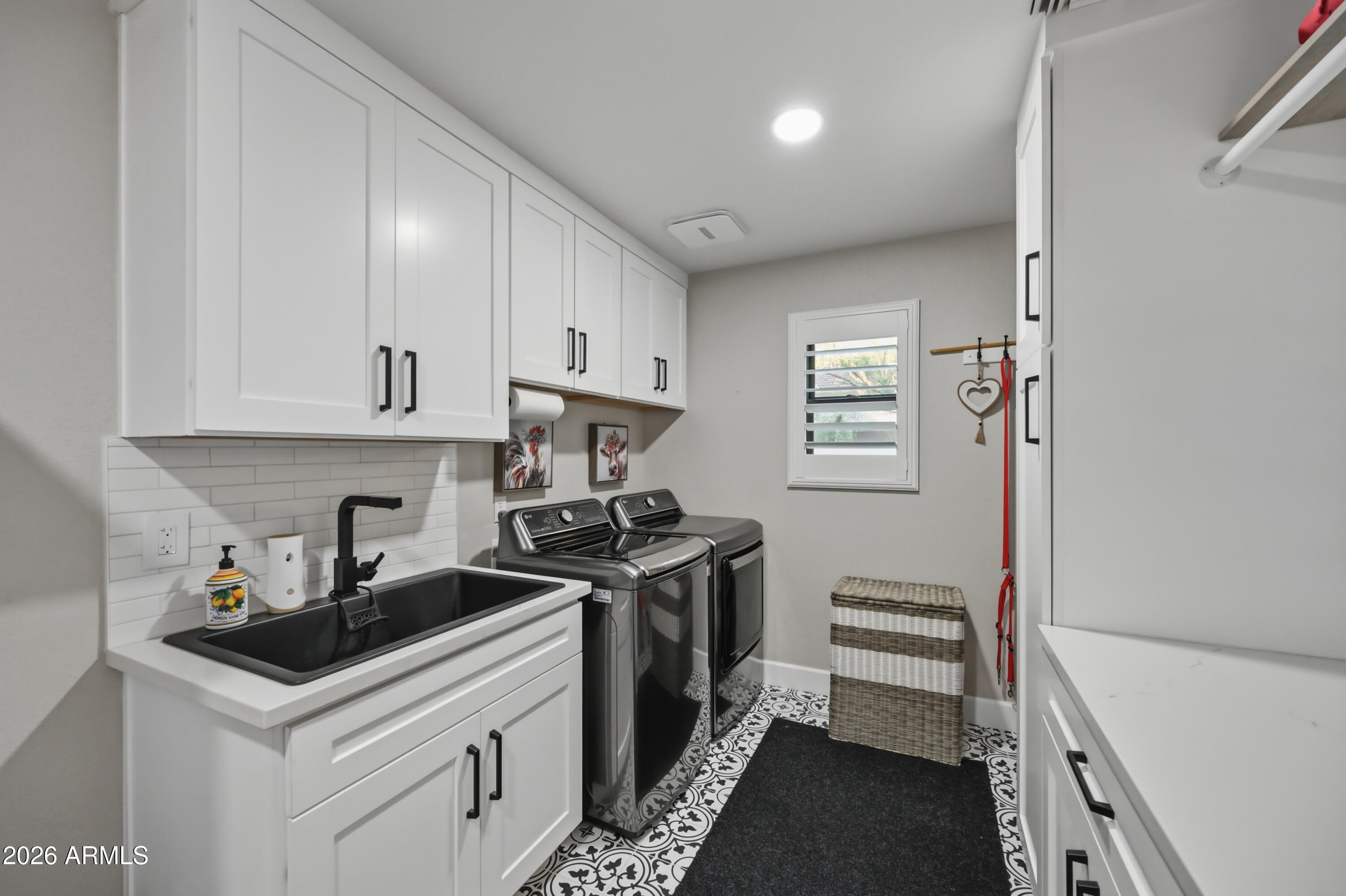 5213 West Dobbins Road Laveen, AZ 85339 - Photo 44 of 69 a kitchen with stainless steel appliances a stove a sink and a refrigerator