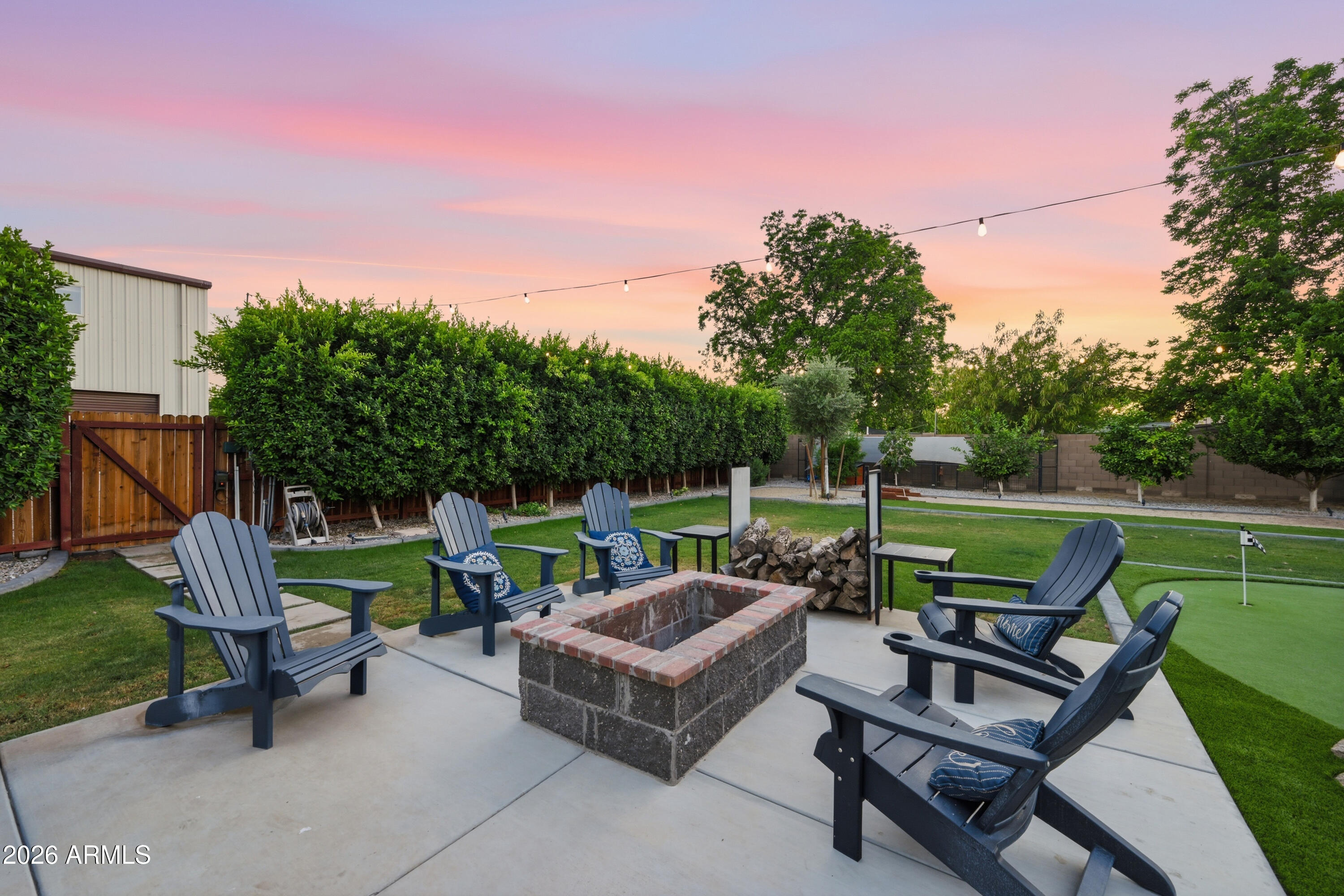 5213 West Dobbins Road Laveen, AZ 85339 - Photo 61 of 69 a view of a chairs and table in the back yard