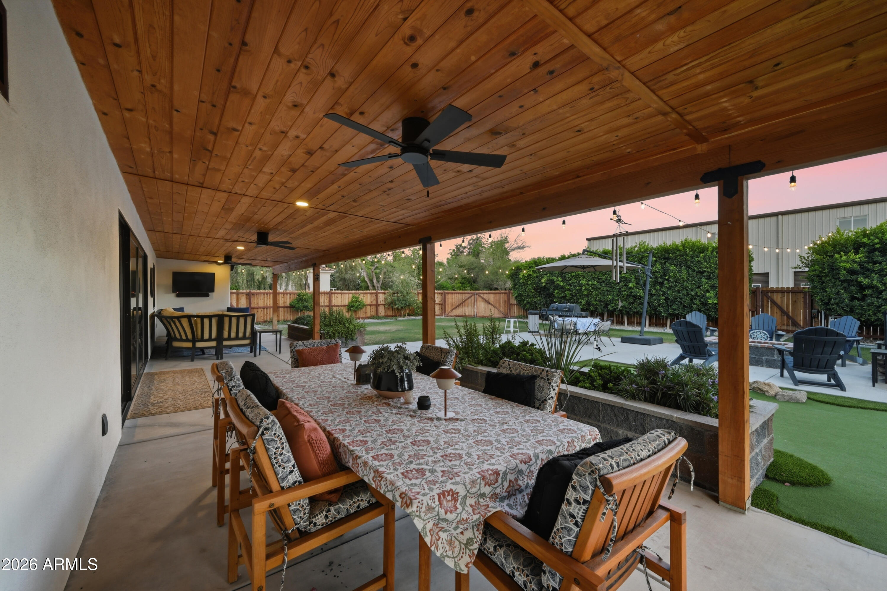 5213 West Dobbins Road Laveen, AZ 85339 - Photo 65 of 69 a view of a patio with a table chairs and a backyard