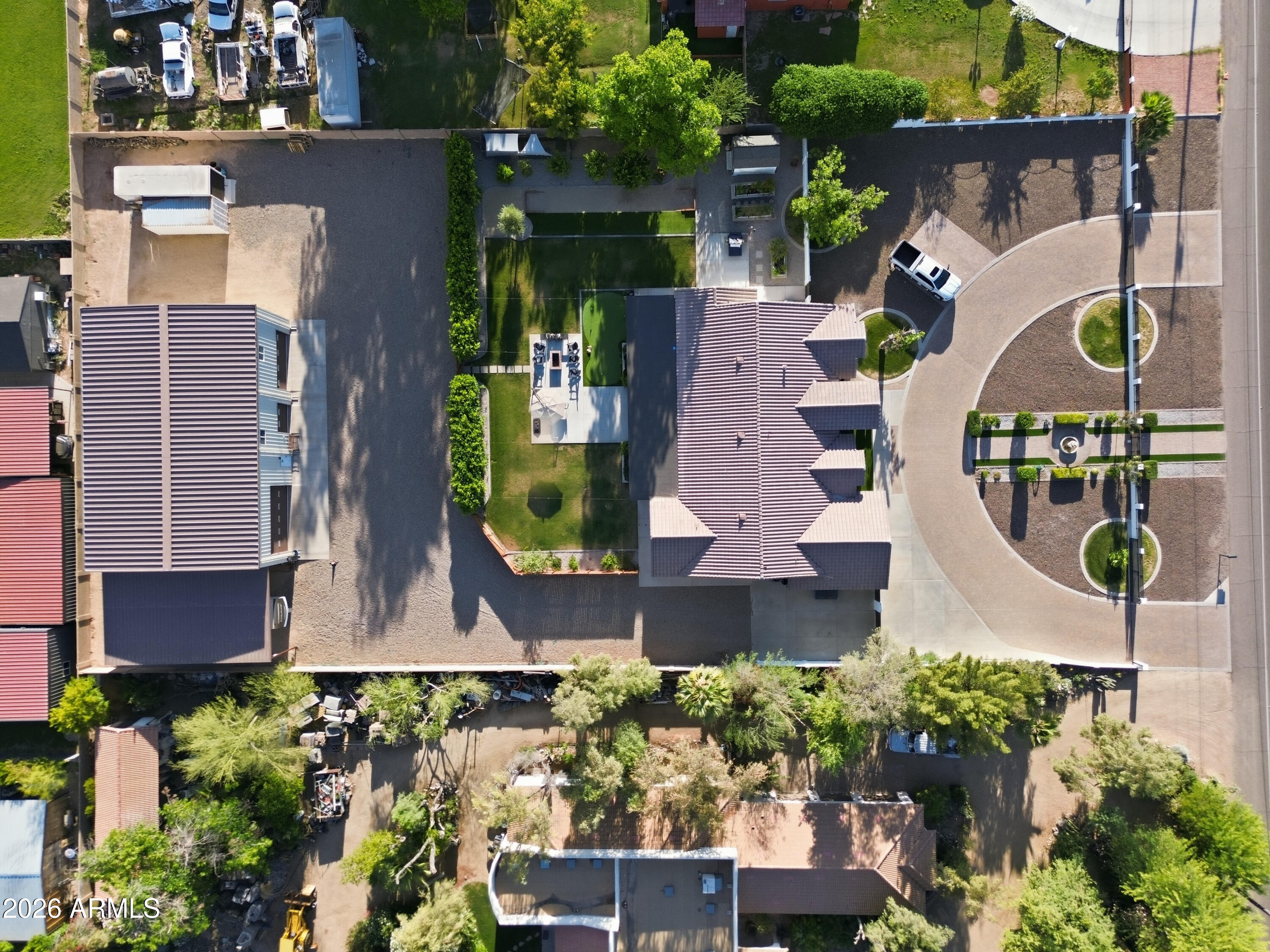 5213 West Dobbins Road Laveen, AZ 85339 - Photo 10 of 69 an aerial view of a house with a garden and plants