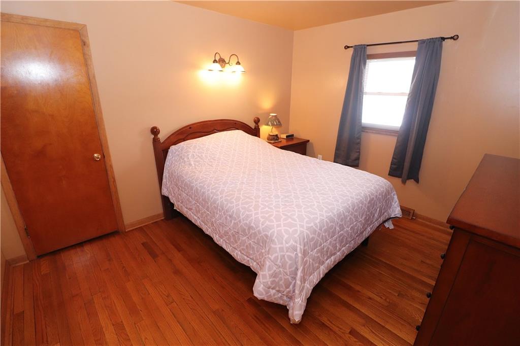 351 Grange Road Rochester, PA 15074 - Photo 14 of 24 Bedroom 2 enjoys REAL OAK FLOORING, neutral wall palette, a window and closet.