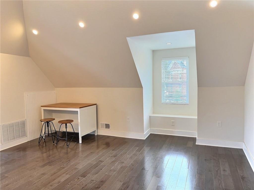 611 Blackburn Road, Unit 3 Sewickley, PA 15143 - Photo 6 of 16 an empty room with wooden floor and a window