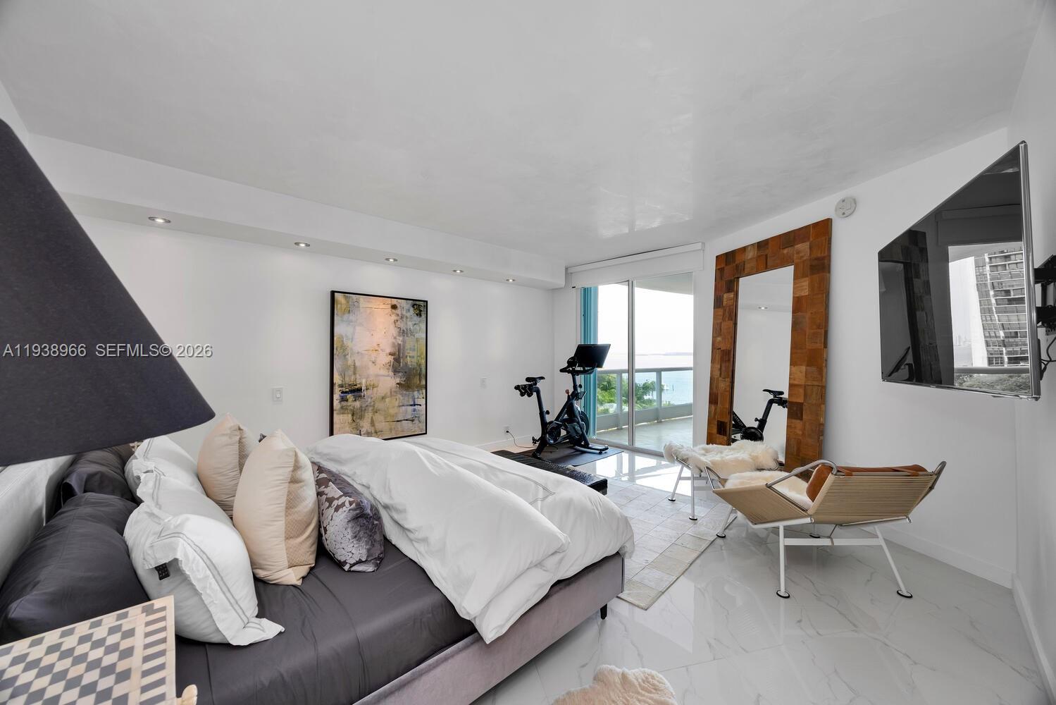 2127 Brickell Avenue, Unit 801 Miami, FL 33129 - Photo 16 of 38 a living room with furniture and large windows