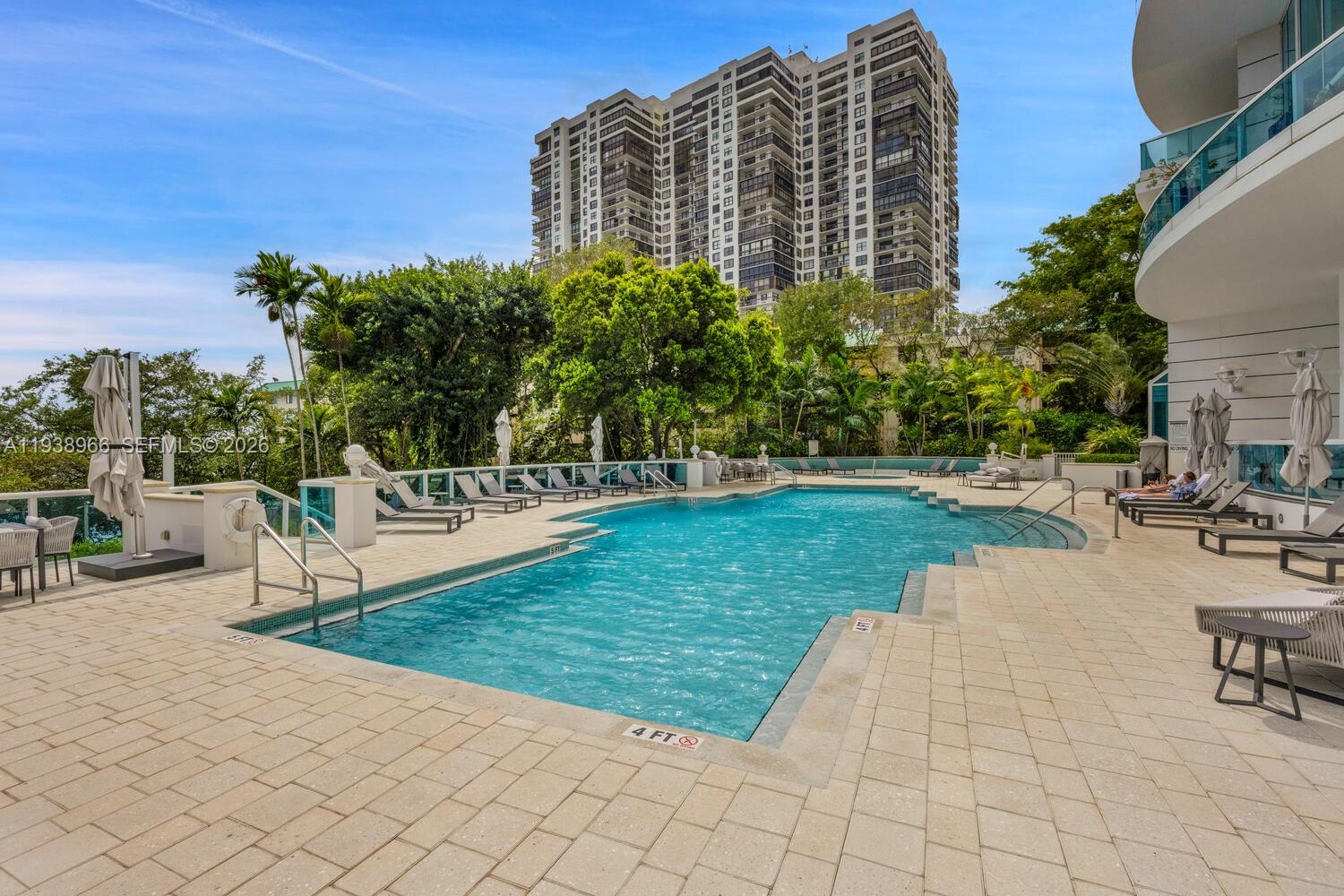 2127 Brickell Avenue, Unit 801 Miami, FL 33129 - Photo 34 of 38 a view of a building with garden space and sitting area