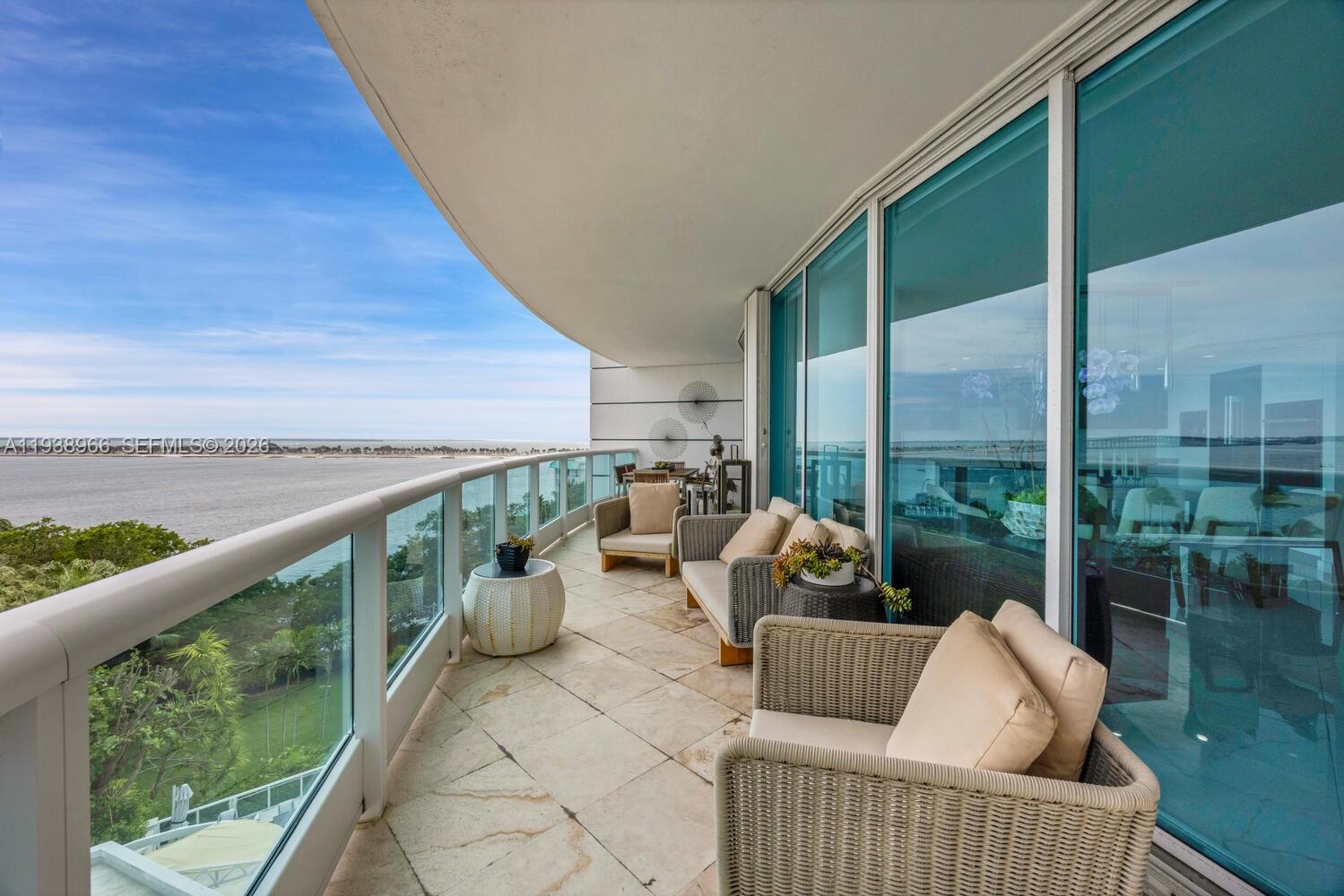 2127 Brickell Avenue, Unit 801 Miami, FL 33129 - Photo 36 of 38 a balcony with furniture and garden view