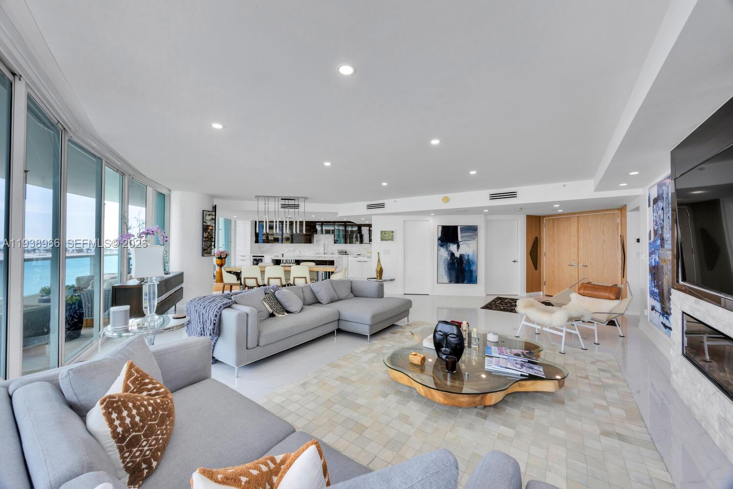 2127 Brickell Avenue, Unit 801 Miami, FL 33129 - Photo 6 of 38 a living room with furniture kitchen view and a large window