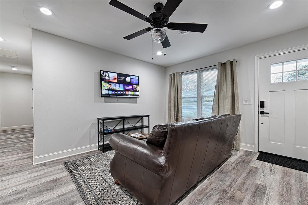 1201 Ridgewood Road Denison, TX 75020 - Photo 12 of 29 Living room featuring a wealth of natural light, ceiling fan, and light hardwood / wood-style flooring