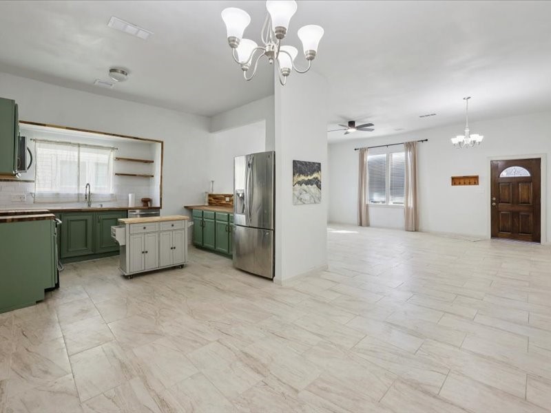 2290 Orange Avenue Beaumont, TX 77701 - Photo 5 of 12 a kitchen with stainless steel appliances a refrigerator sink and cabinets