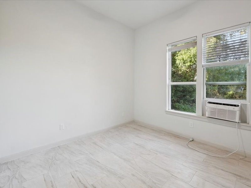 2290 Orange Avenue Beaumont, TX 77701 - Photo 6 of 12 an empty room with a window