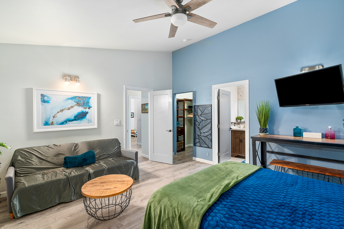 68-1846 Puu Nui Street Waikoloa, HI 96738 - Photo 16 of 29 a living room with furniture and a flat screen tv