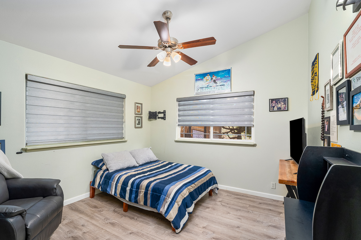68-1846 Puu Nui Street Waikoloa, HI 96738 - Photo 19 of 29 a bedroom with a bed and wooden floor