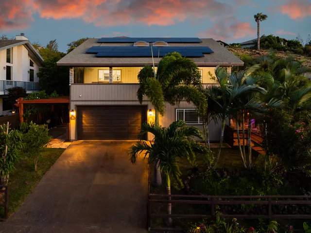 a view of a patio with table and chairs and potted plants