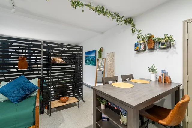 a kitchen with a table and chairs in it
