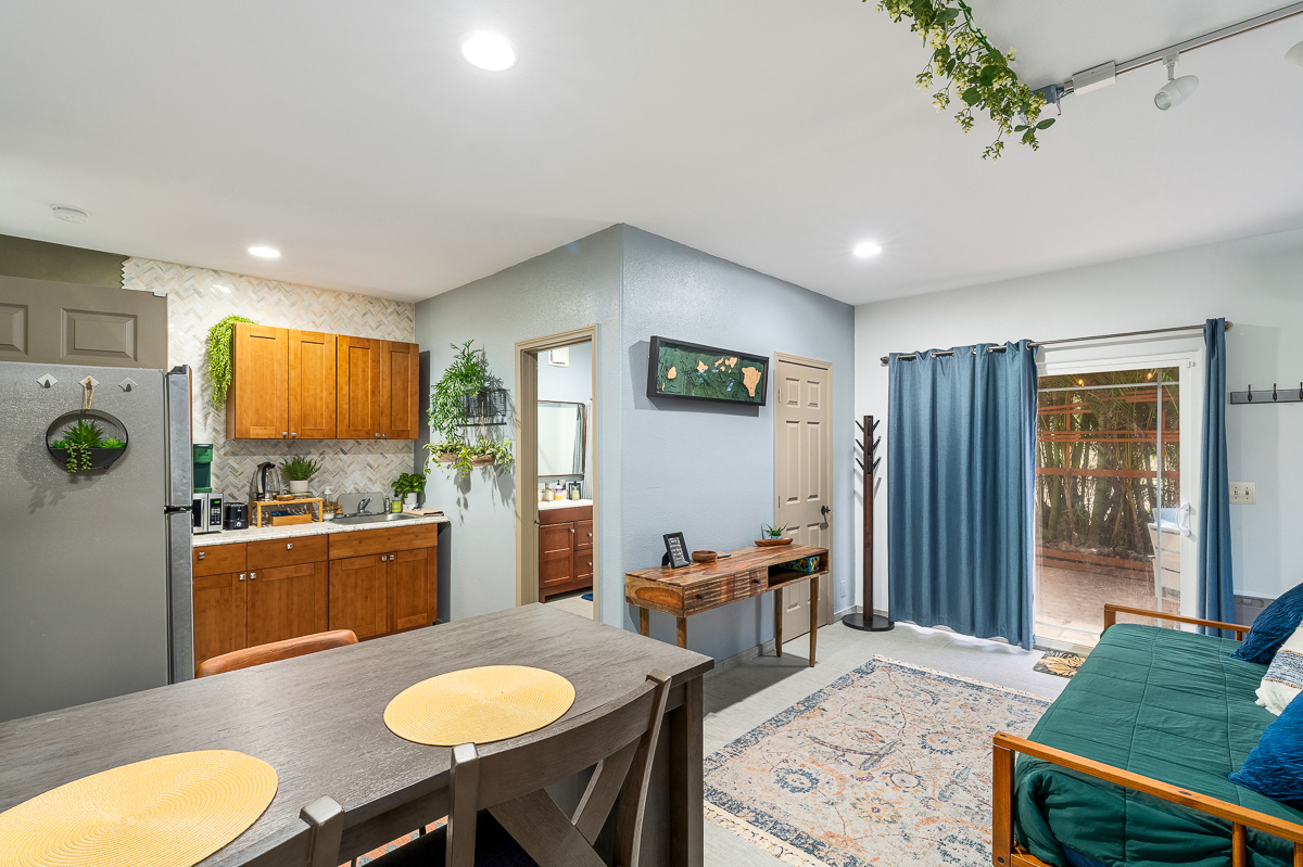 68-1846 Puu Nui Street Waikoloa, HI 96738 - Photo 24 of 29 a kitchen with sink refrigerator dining table and chairs