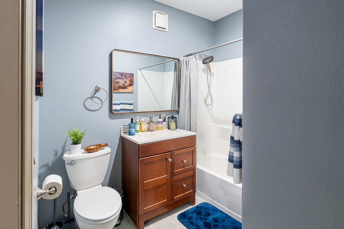 68-1846 Puu Nui Street Waikoloa, HI 96738 - Photo 26 of 29 a bathroom with a sink mirror vanity and toilet