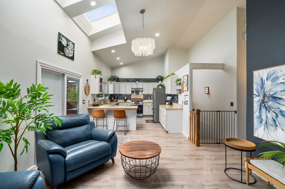 68-1846 Puu Nui Street Waikoloa, HI 96738 - Photo 4 of 29 a living room with furniture a chandelier and a rug