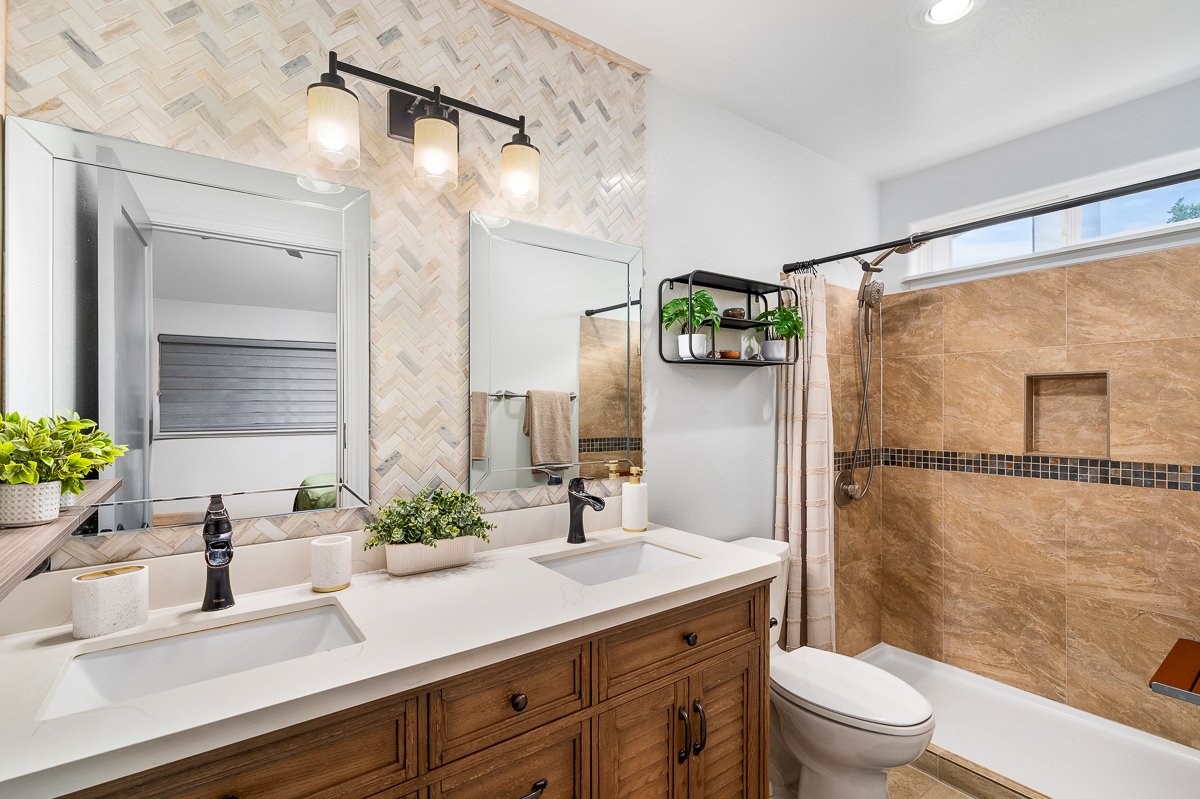 68-1846 Puu Nui Street Waikoloa, HI 96738 - Photo 5 of 29 a bathroom with a granite countertop sink mirror toilet and shower