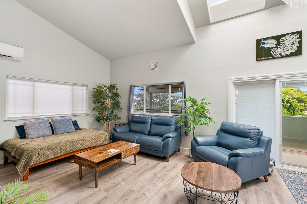 68-1846 Puu Nui Street Waikoloa, HI 96738 - Photo 8 of 29 a living room with furniture a rug and a potted plant