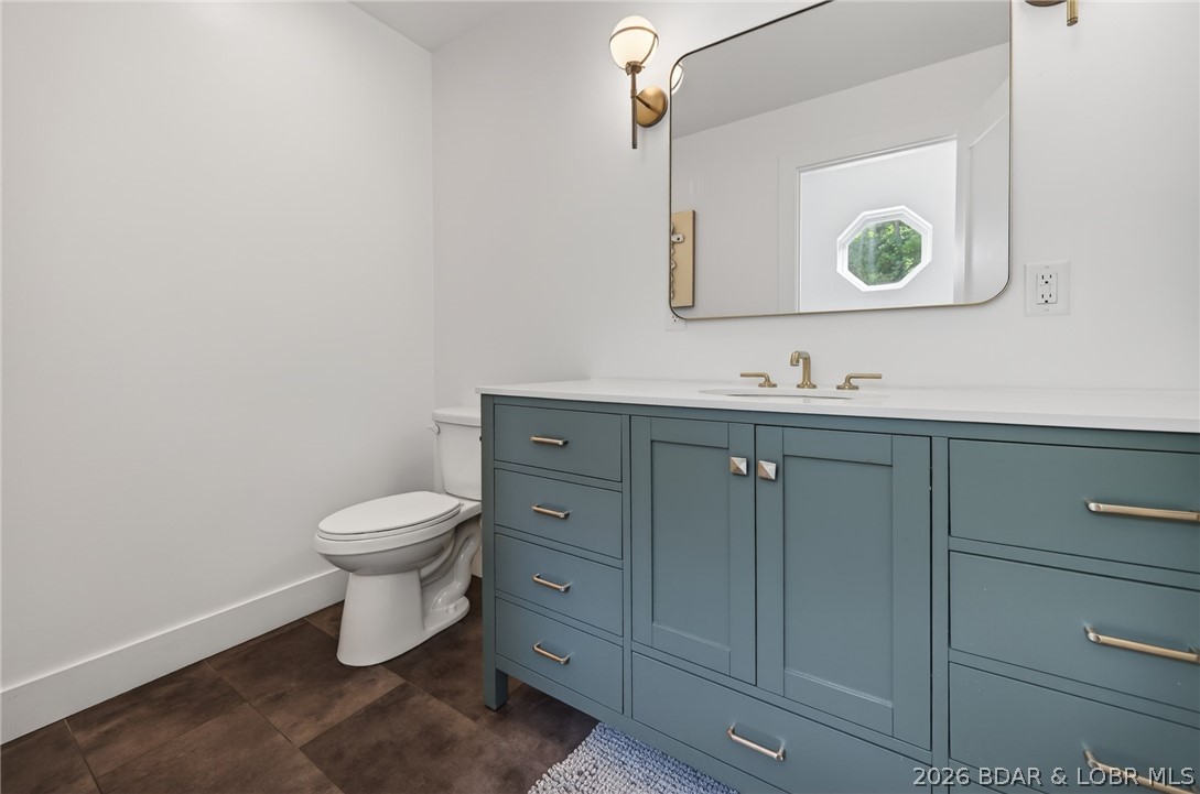25 Old Sassafrass Road Eldon, MO 65026 - Photo 12 of 58 Upper level powder room with new vanity and toilet