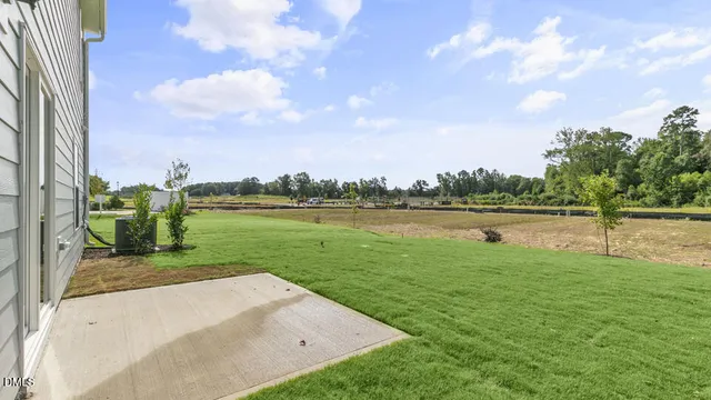 a view of a backyard of a house
