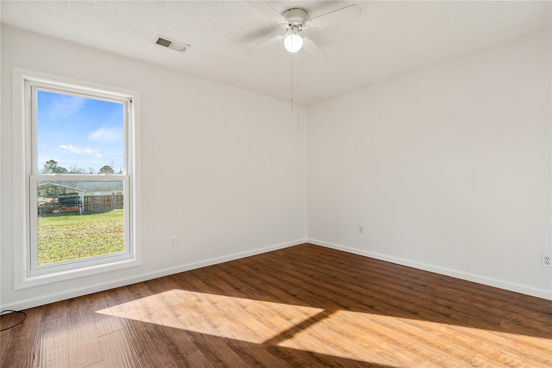 2305 Millgate Road Anderson, SC 29621 - Photo 15 of 18 Hardwood-style flooring and a window provide a bright, comfortable space.