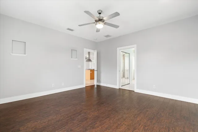 a spacious bathroom with a double vanity sink a mirror and a bathtub