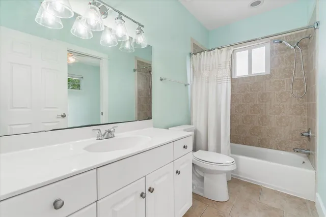 a view of room with window and ceiling fan