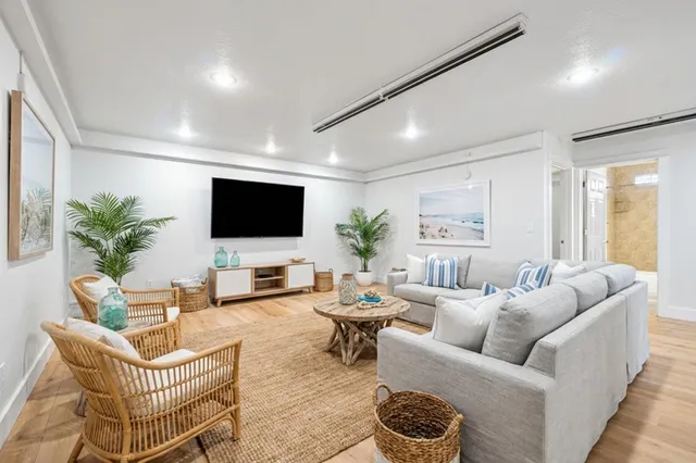 an aerial view of residential houses with outdoor space and street view