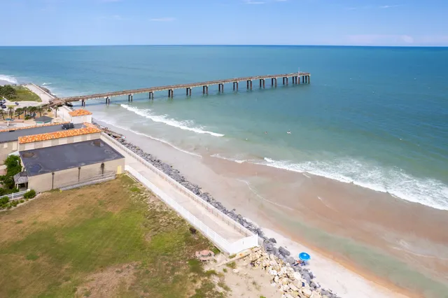 a view of a backyard of the house