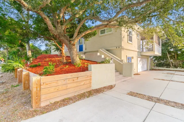 an aerial view of a house with outdoor space