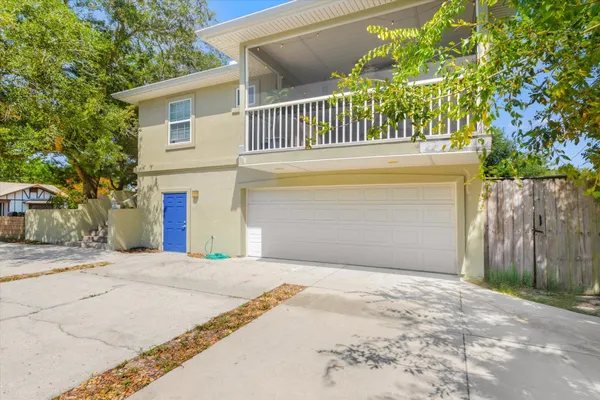 a large kitchen with stainless steel appliances granite countertop a sink and a stove