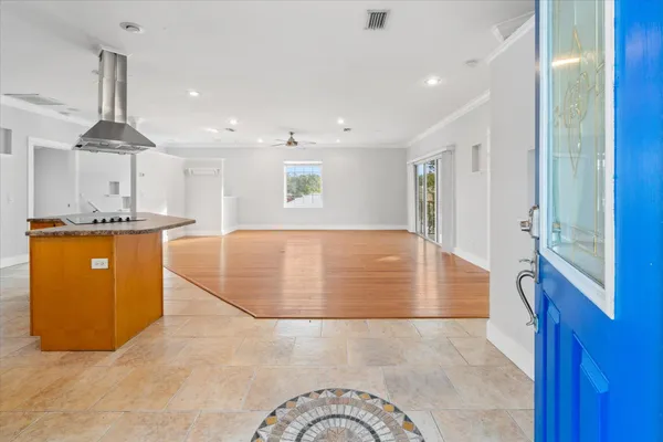 a view of kitchen with furniture and refrigerator