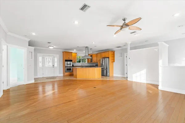 a living room with furniture and a potted plant