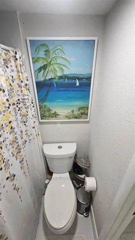 a bathroom with a toilet and a sink