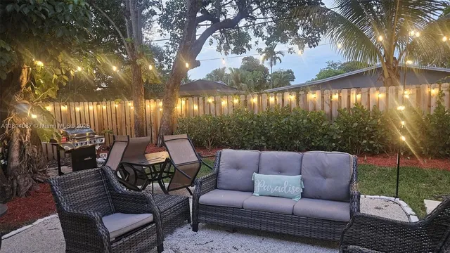 a outdoor living space with furniture and city view