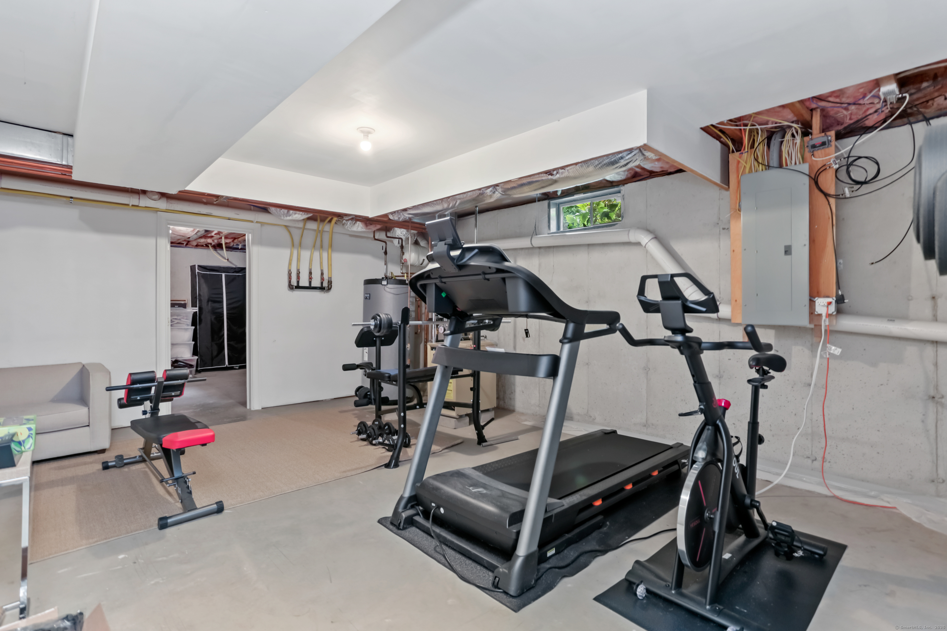 162 Country Road, Unit 162 Fairfield, CT 06824 - Photo 26 of 33 a view of a room with gym equipment