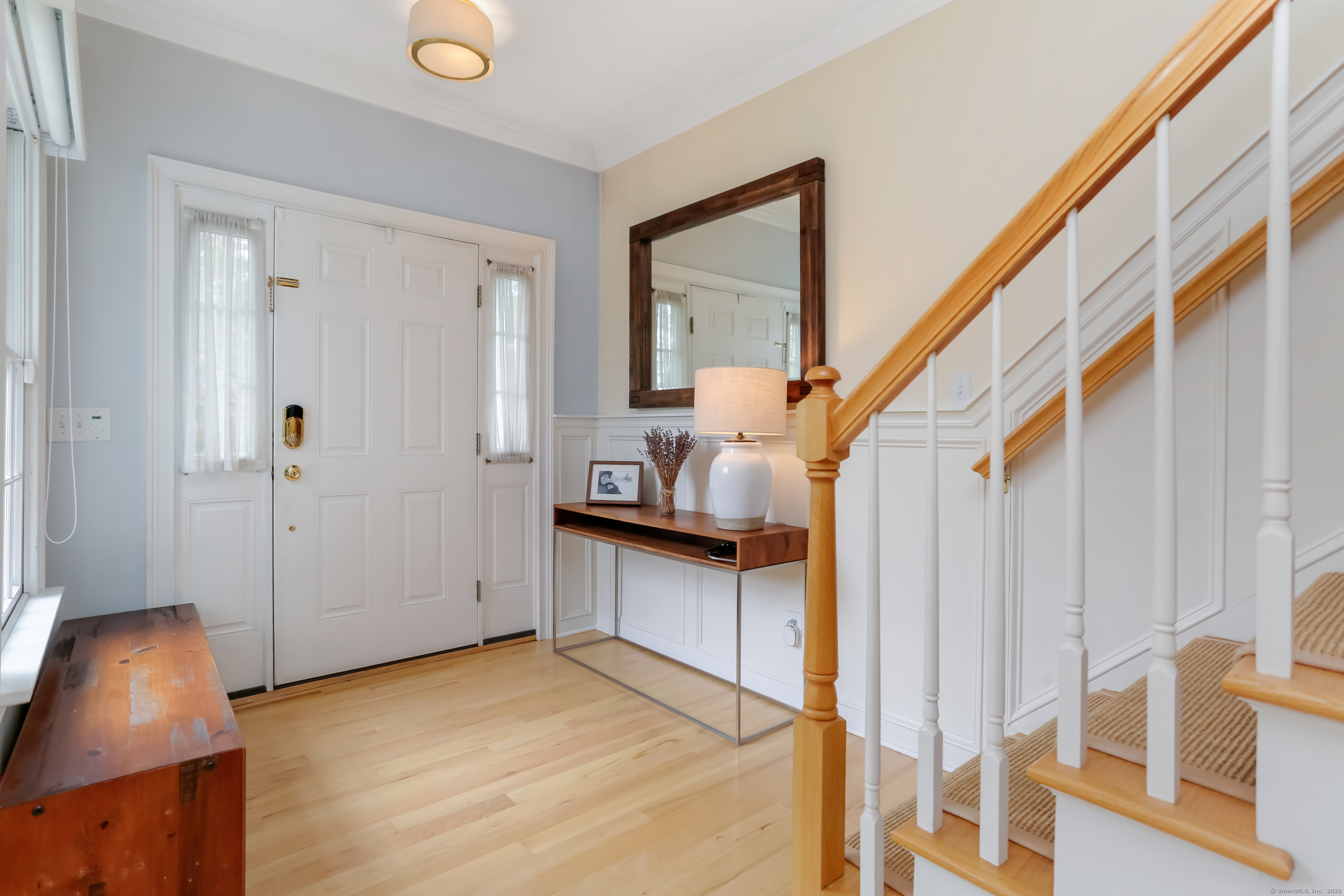 162 Country Road, Unit 162 Fairfield, CT 06824 - Photo 6 of 33 a view of entryway and hall with wooden floor