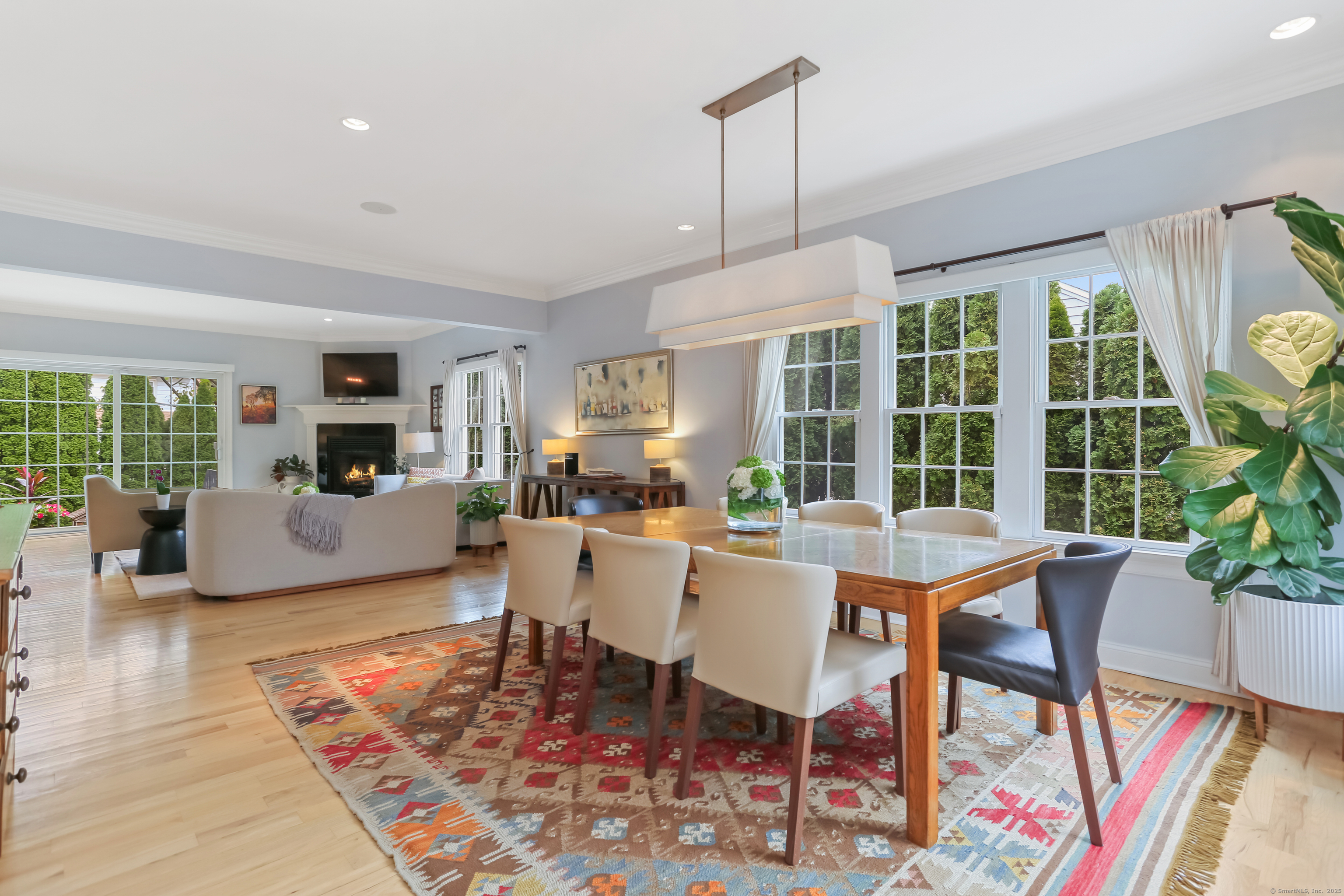 162 Country Road, Unit 162 Fairfield, CT 06824 - Photo 7 of 33 a view of a dining room with furniture window and wooden floor