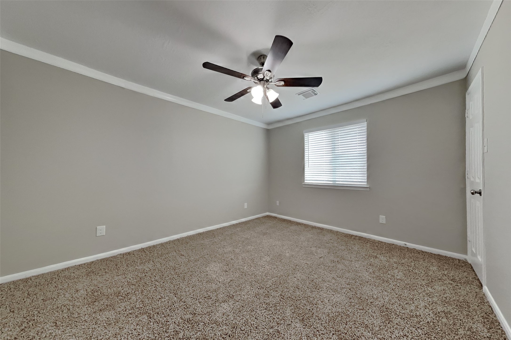 19710 Ringwald Court Spring, TX 77379 - Photo 11 of 20 a view of a big room with a ceiling fan and a window