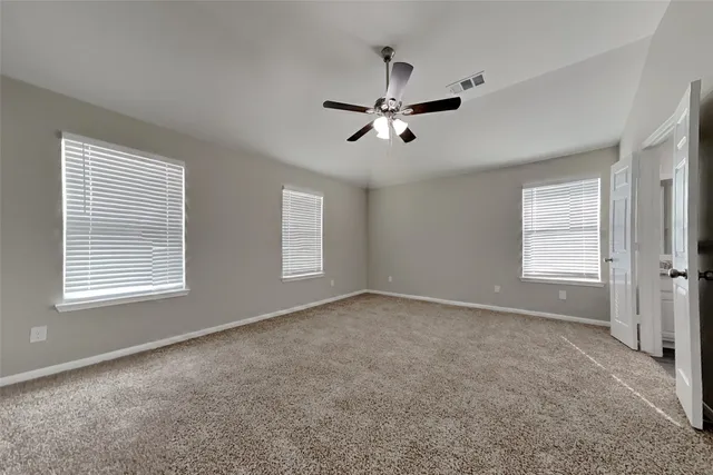 a view of empty room with windows