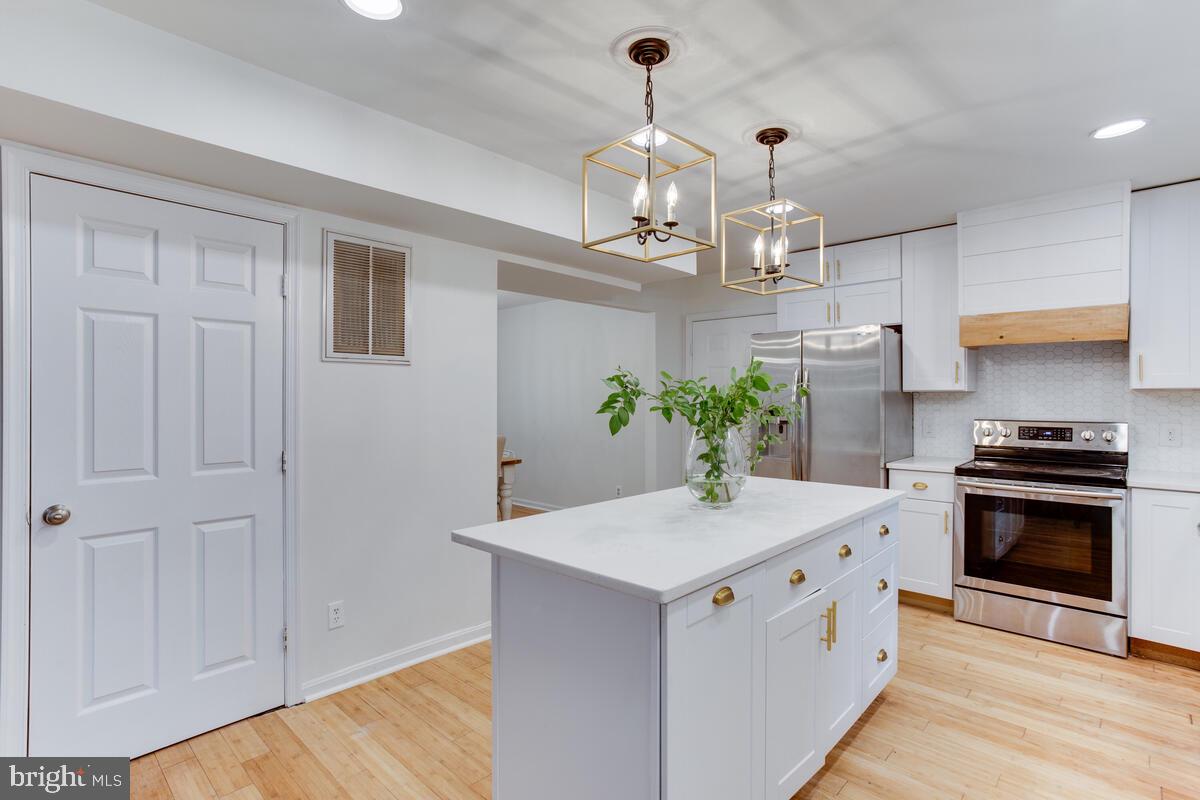 13185 Joy Road Lusby, MD 20657 - Photo 22 of 58 White cabinets with quartz counter tops.