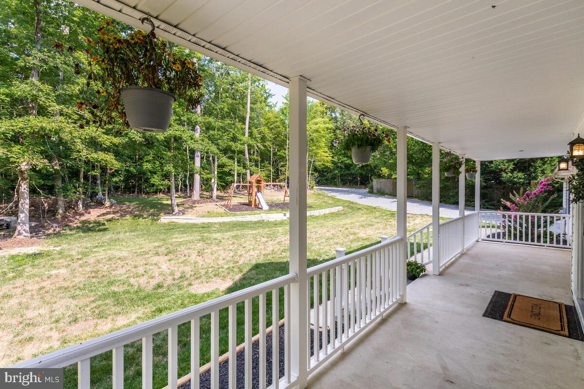 13185 Joy Road Lusby, MD 20657 - Photo 4 of 58 Large front porch is ready for your swing.