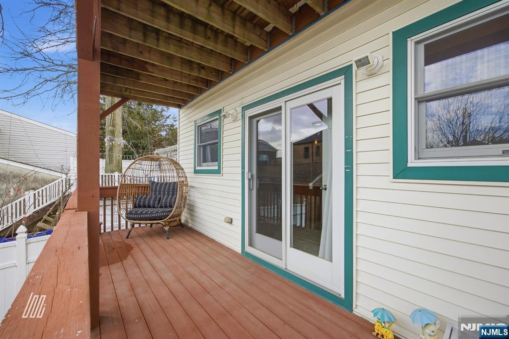331 Undercliff Avenue Edgewater, NJ 07020 - Photo 20 of 45 a balcony with furniture and wooden floor